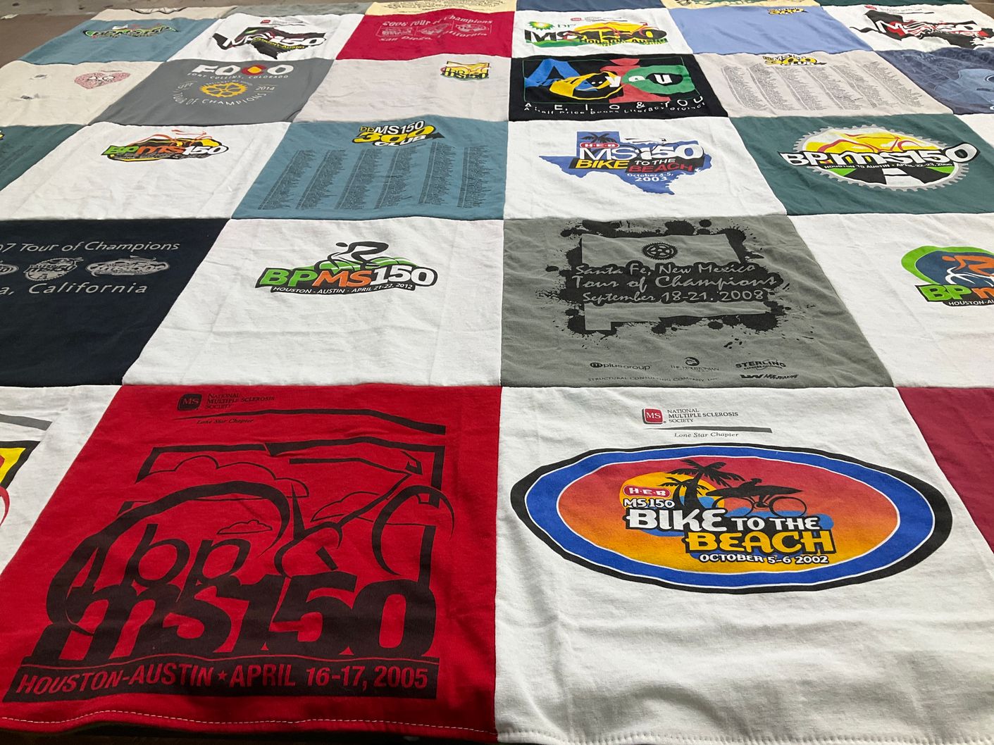 T-shirt quilt with cycling, charity events themes by Mary from SC