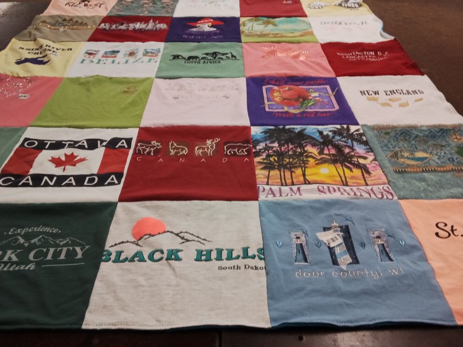 T-shirt quilt with traveling, tourism themes by Cecilia from IA