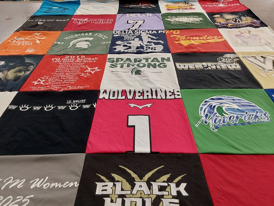 T-shirt quilt featuring mavericks, wolverines by Laura from CA