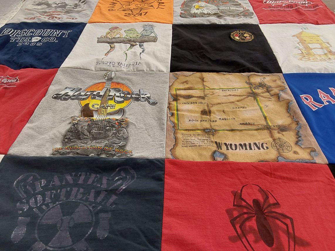 T-shirt quilt with softball, motorcycles themes by Daphne from TX