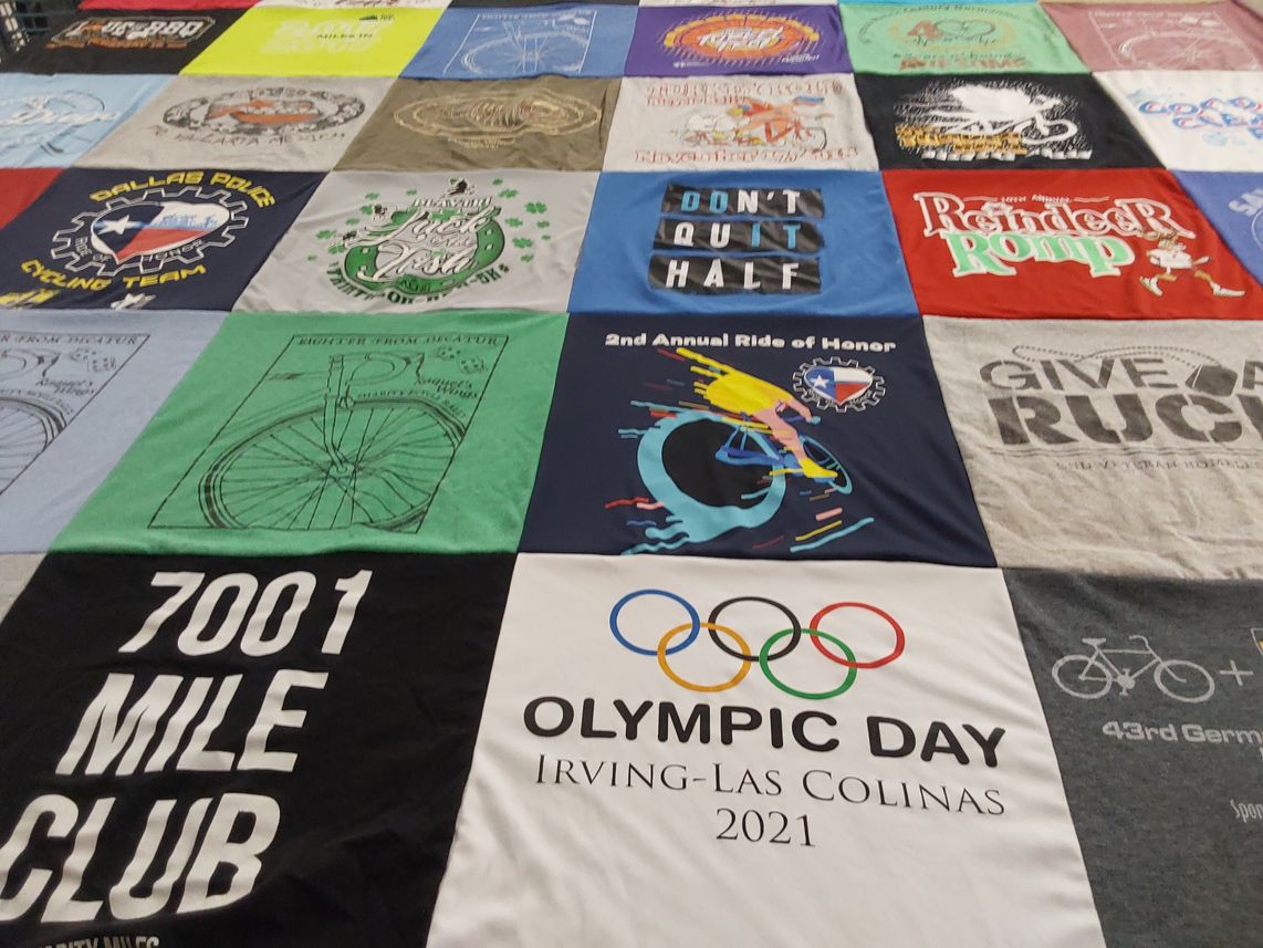 T-shirt quilt with cycling, rugby themes by Tracy from TX