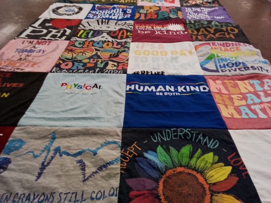 T-shirt quilt with education, mental health themes by Kristin from CA
