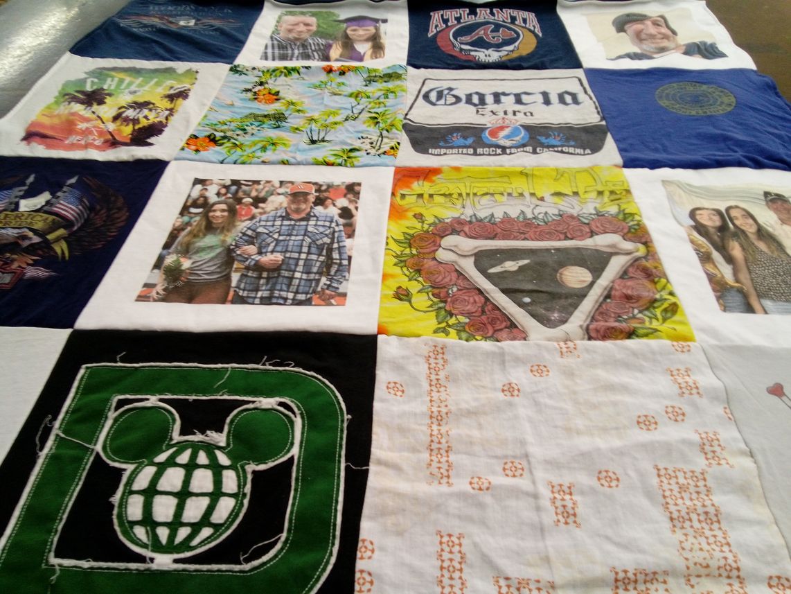 T-shirt quilt with travel, music themes by Heather from IA