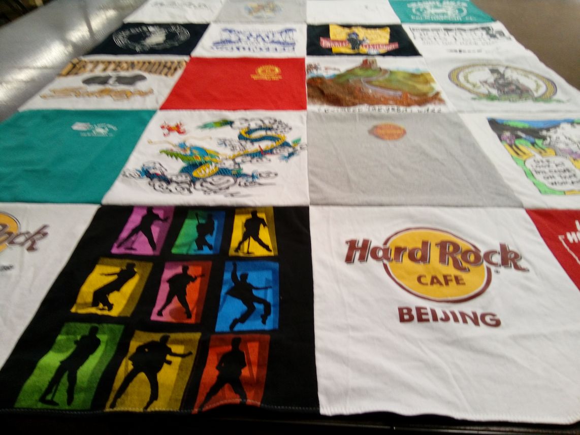 T-shirt quilt with travel, music themes by Barbara from IL