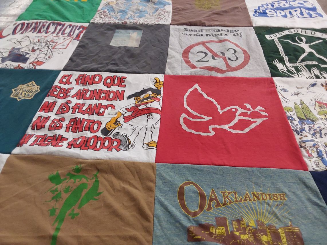 T-shirt quilt with community, culture themes by MaryBeth from CA