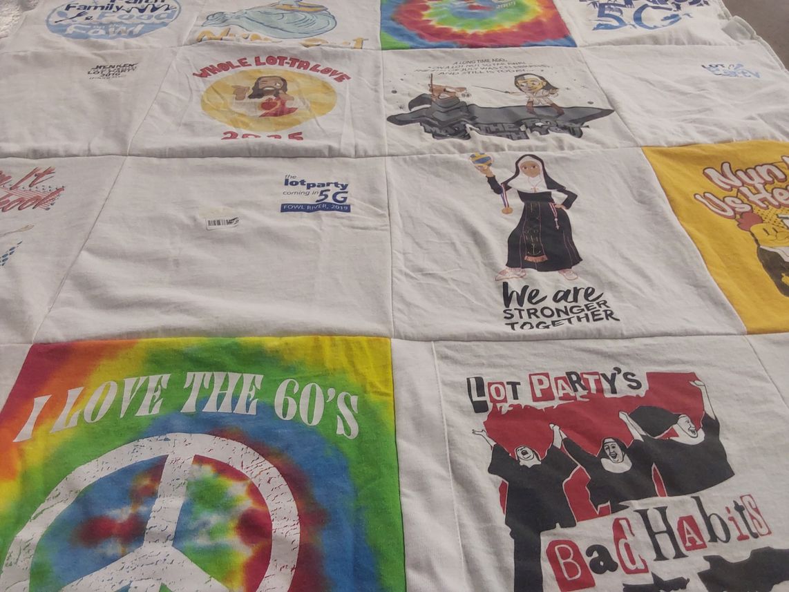 T-shirt quilt with community, music themes by Angela from OH