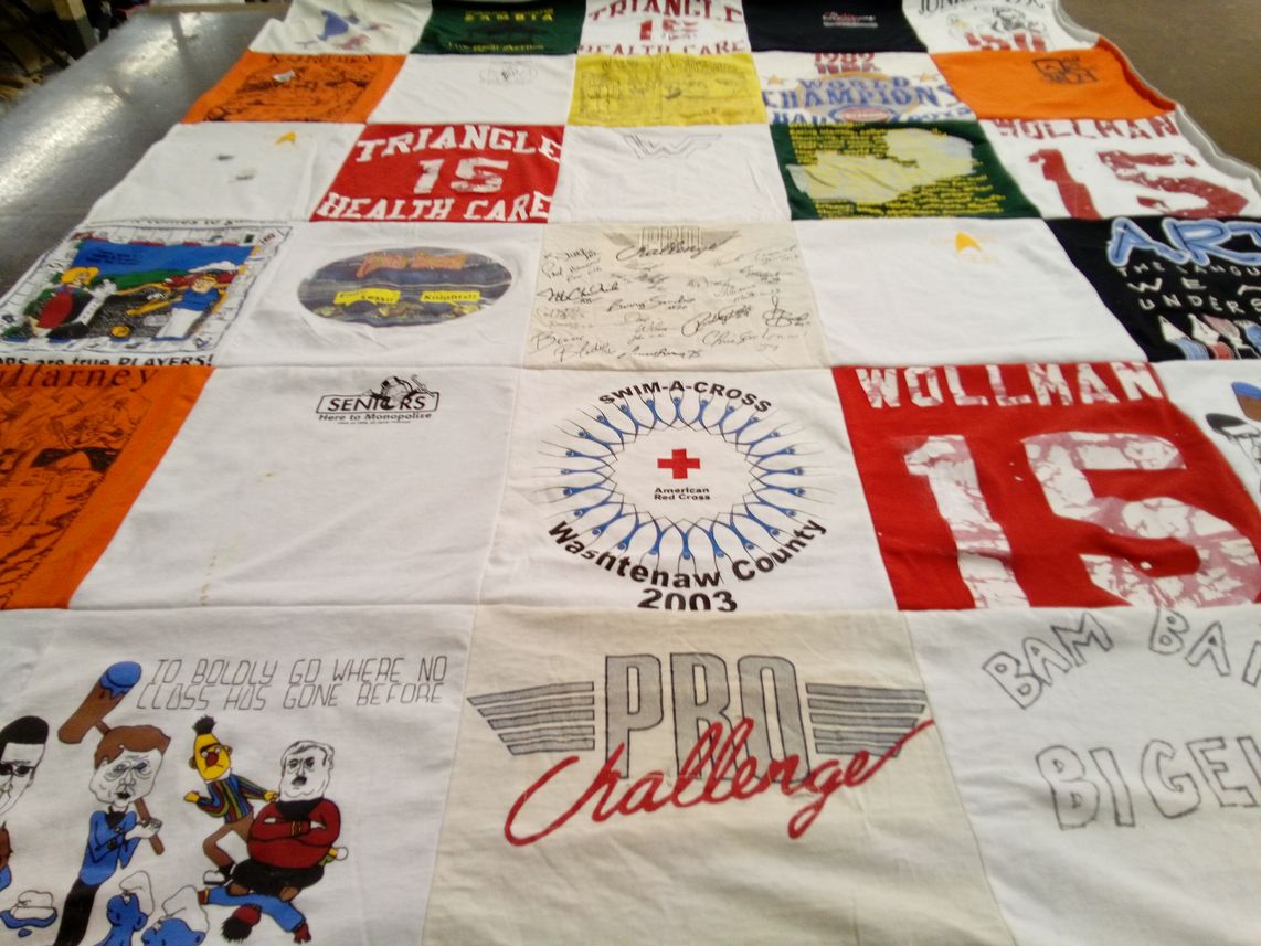 T-shirt quilt with healthcare, community service themes by Marty from TX
