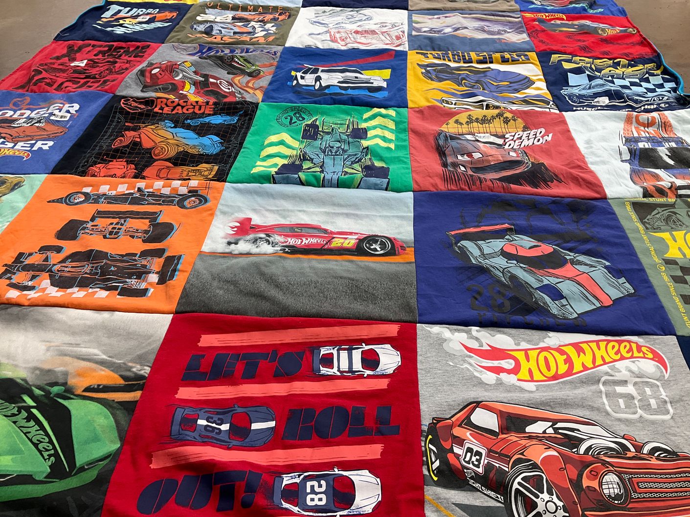 T-shirt quilt with cars, racing themes by Cherie from IL