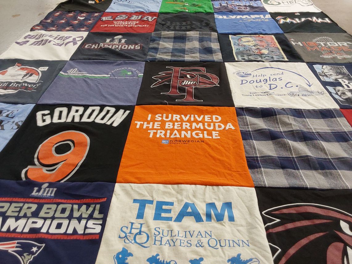 T-shirt quilt with sports, travel themes by Josephine from MA