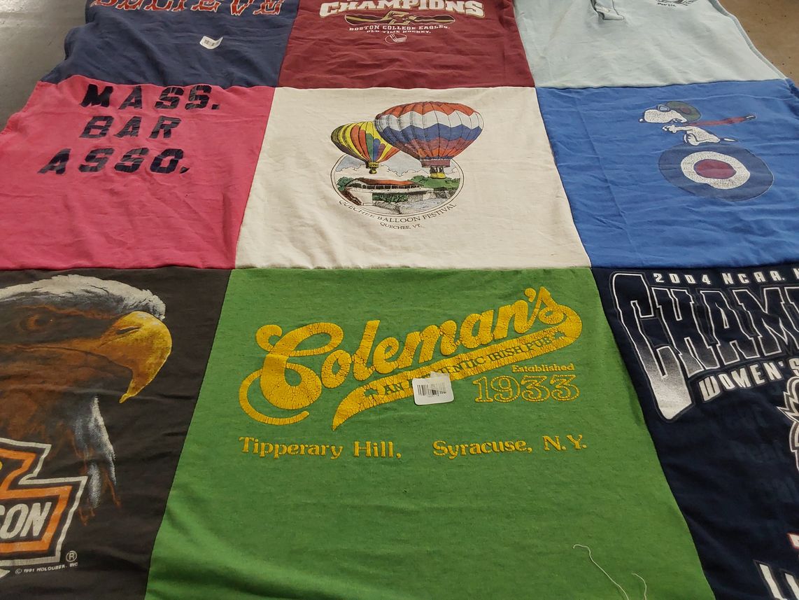 T-shirt quilt with sports, festivals themes by Christine from MA
