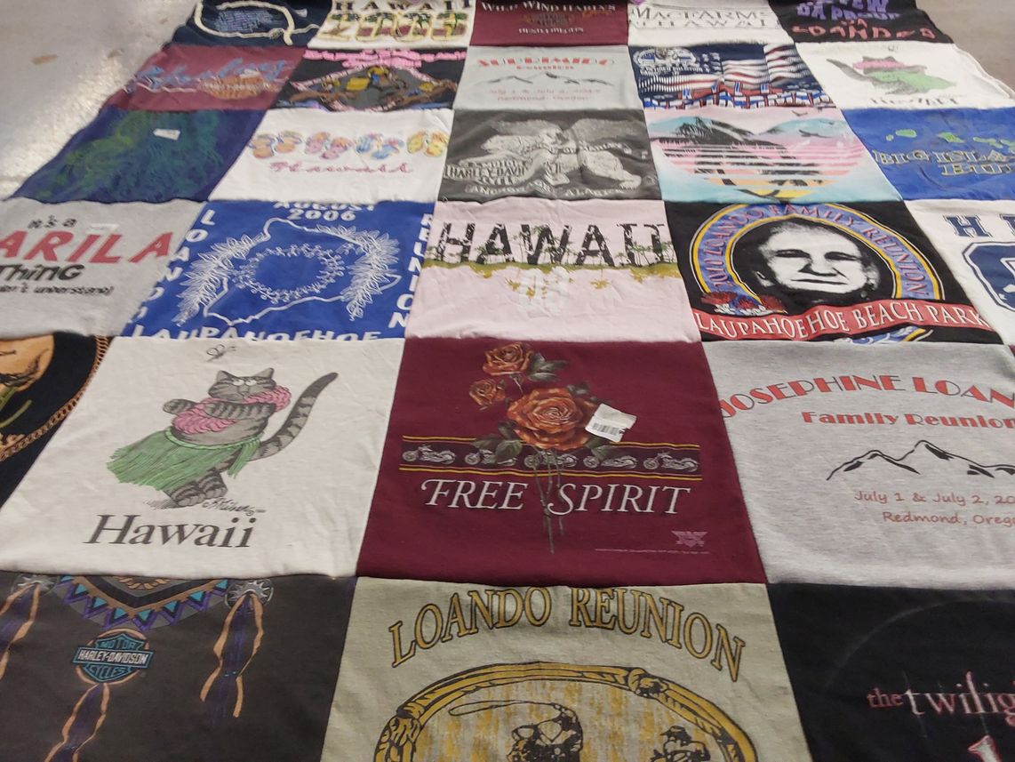 T-shirt quilt with family gatherings, travel themes by Susanna from OR