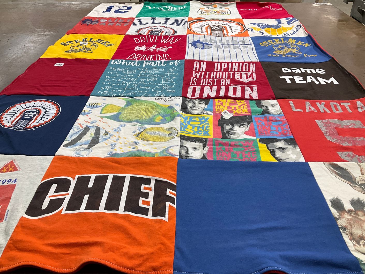 T-shirt quilt with community, art themes by Lori from IL