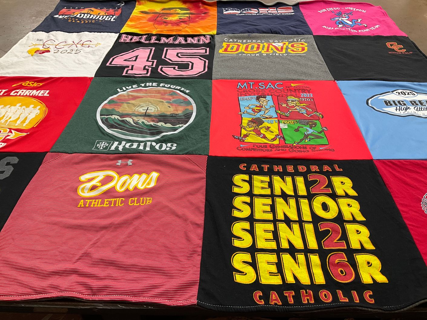 T-shirt quilt featuring catholic dons track and field by Elizabeth from CA