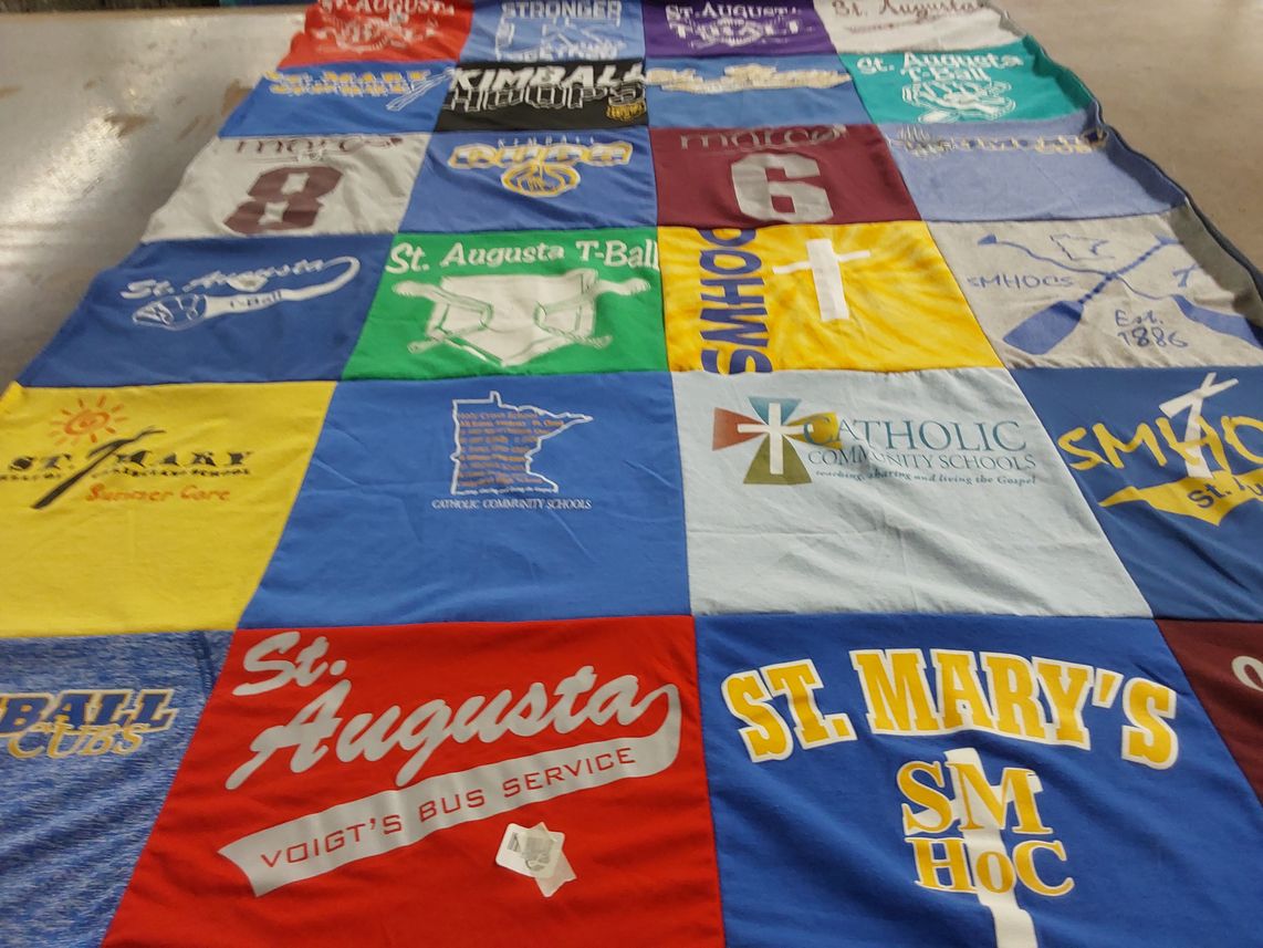 T-shirt quilt featuring st. augustaa t-ball, kimball high school by Stacy from MN