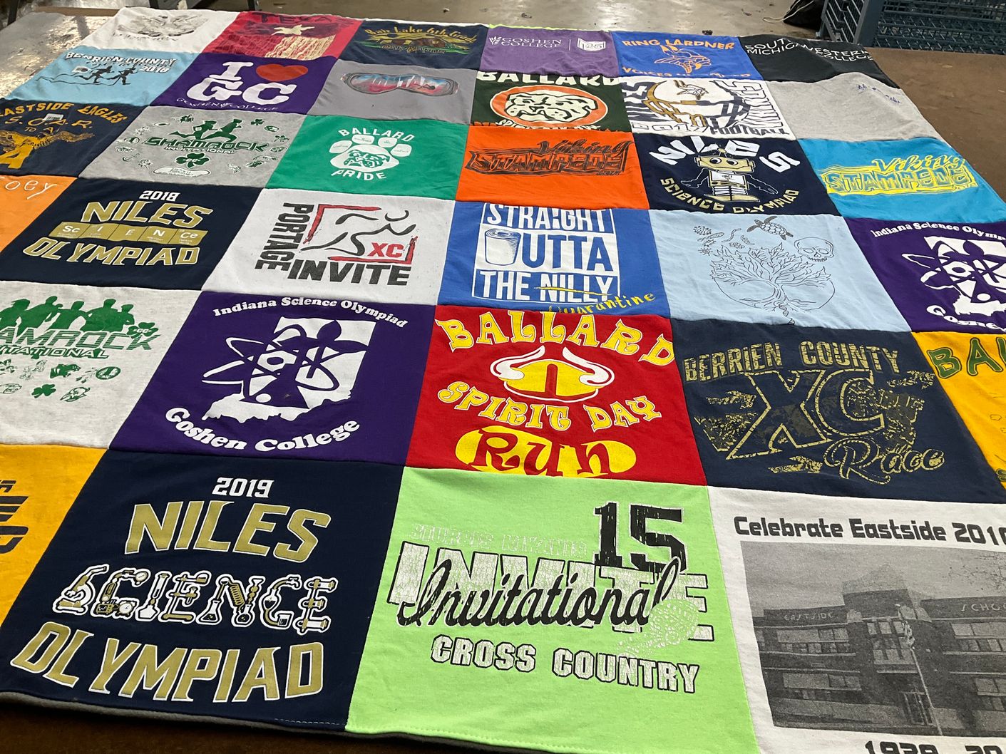 T-shirt quilt featuring ballard cross country team, berrien county xc team by Zoey from MI