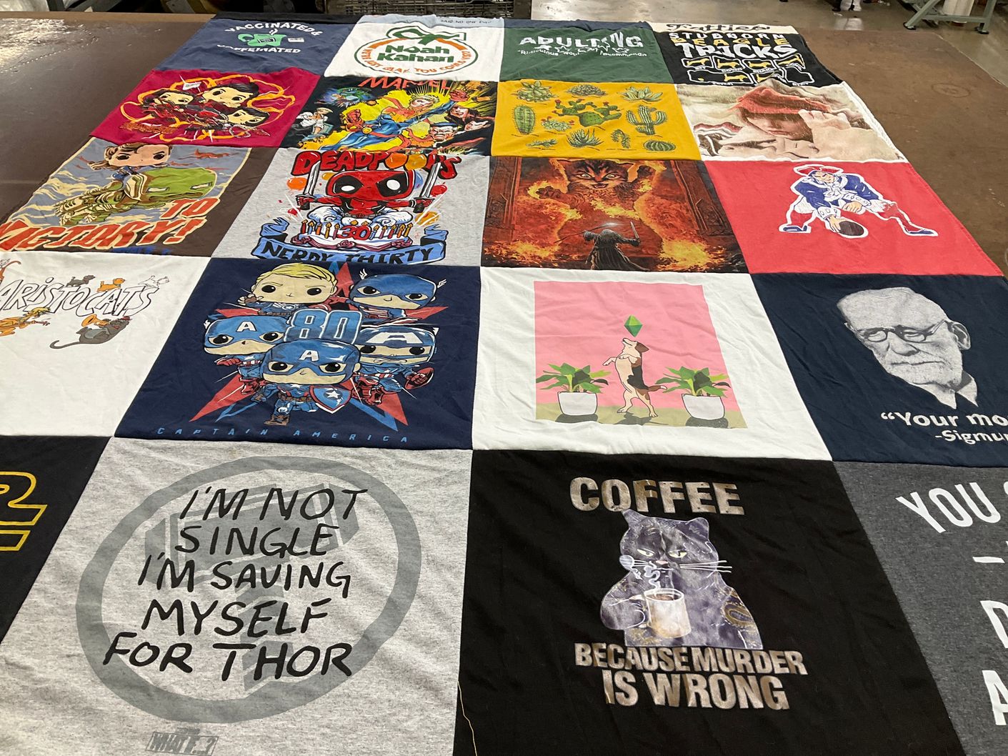 T-shirt quilt with comics, tv shows themes by Susanne from CA