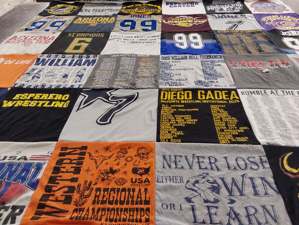 T-shirt quilt featuring esperero wrestling by Lyndee from AZ
