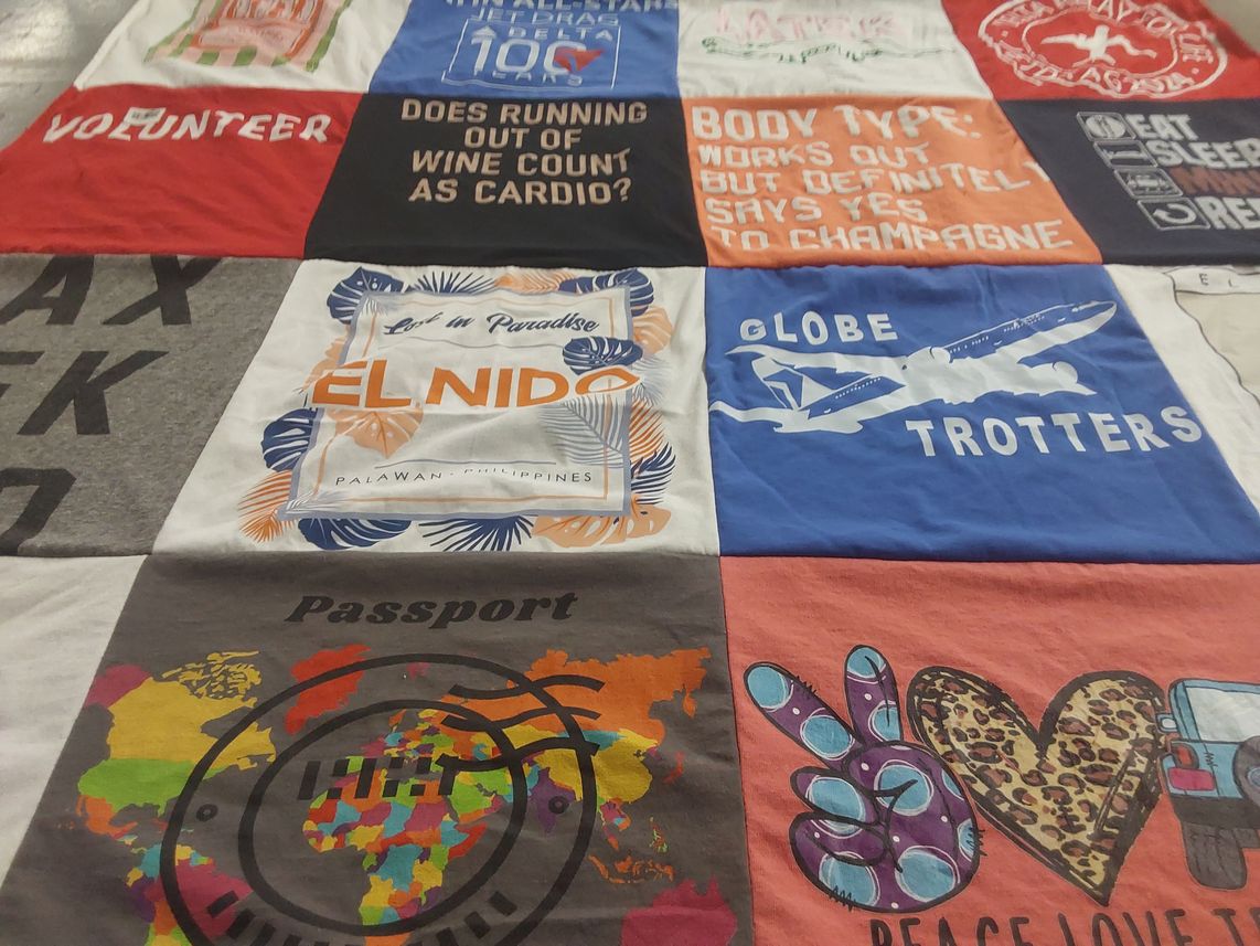 T-shirt quilt with travel, volunteering themes by Maru from FL