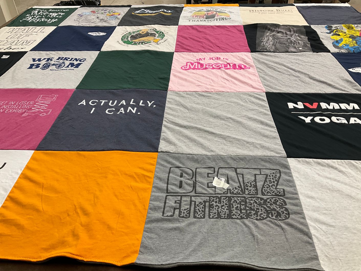 T-shirt quilt with fitness, yoga themes by Maureen from OH