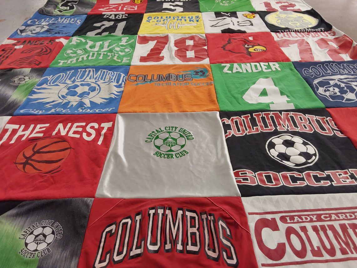 T-shirt quilt with soccer, basketball themes by Pam from WI