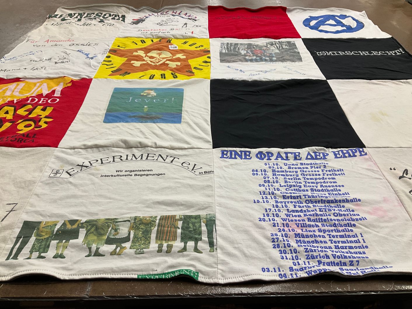 T-shirt quilt with activism, cultural exchange themes by Amanda from MO