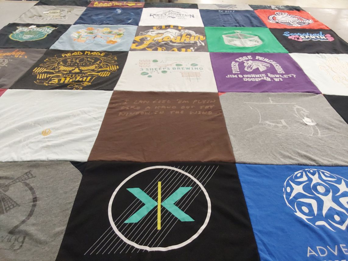 T-shirt quilt with brewing, outdoors themes by Heather from WI
