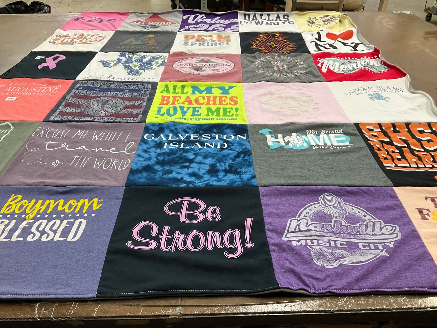 T-shirt quilt with travel, music themes by Jamie from TX