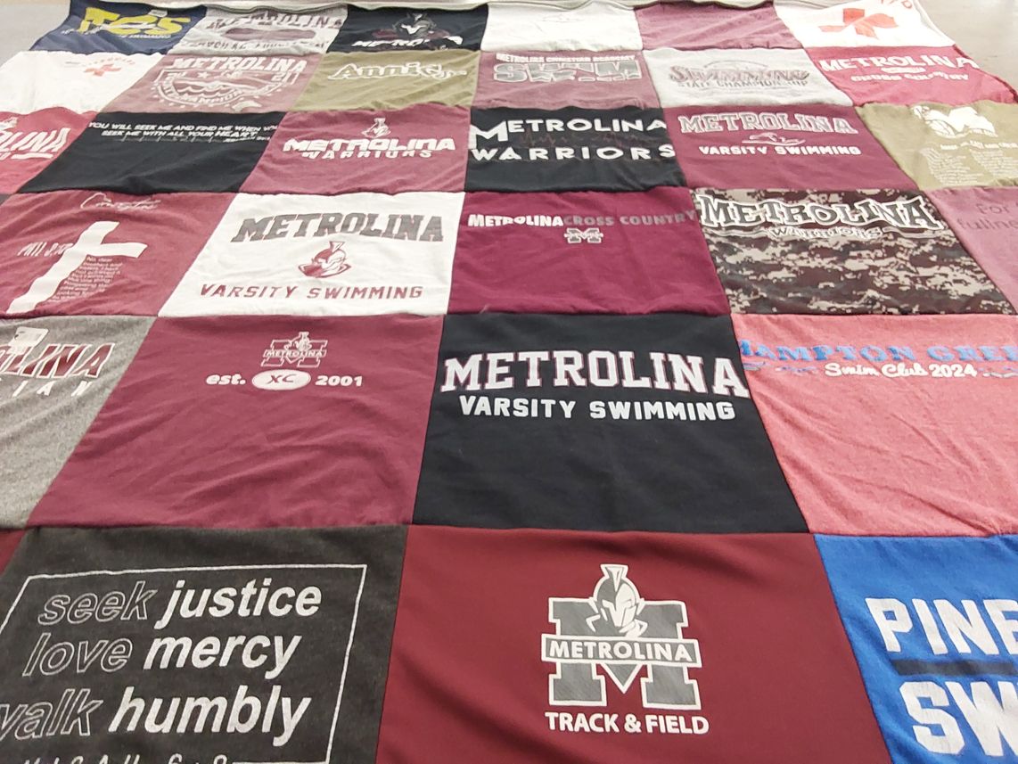 T-shirt quilt featuring metrolina warriors, metrolina varsity swimming by Polly from NC