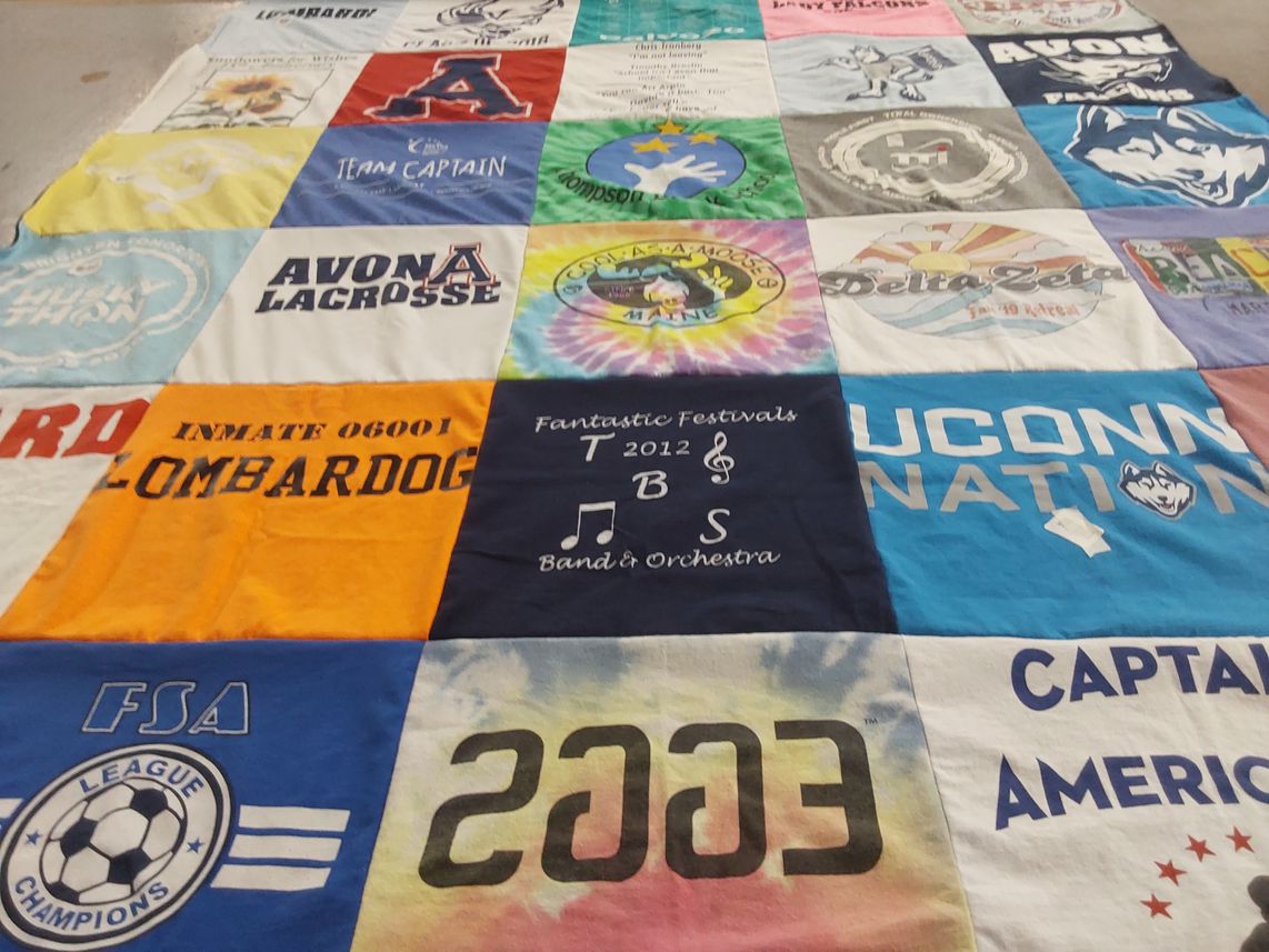 T-shirt quilt featuring avon high school lacrosse team, university of connecticut huskies by Kristin from SC