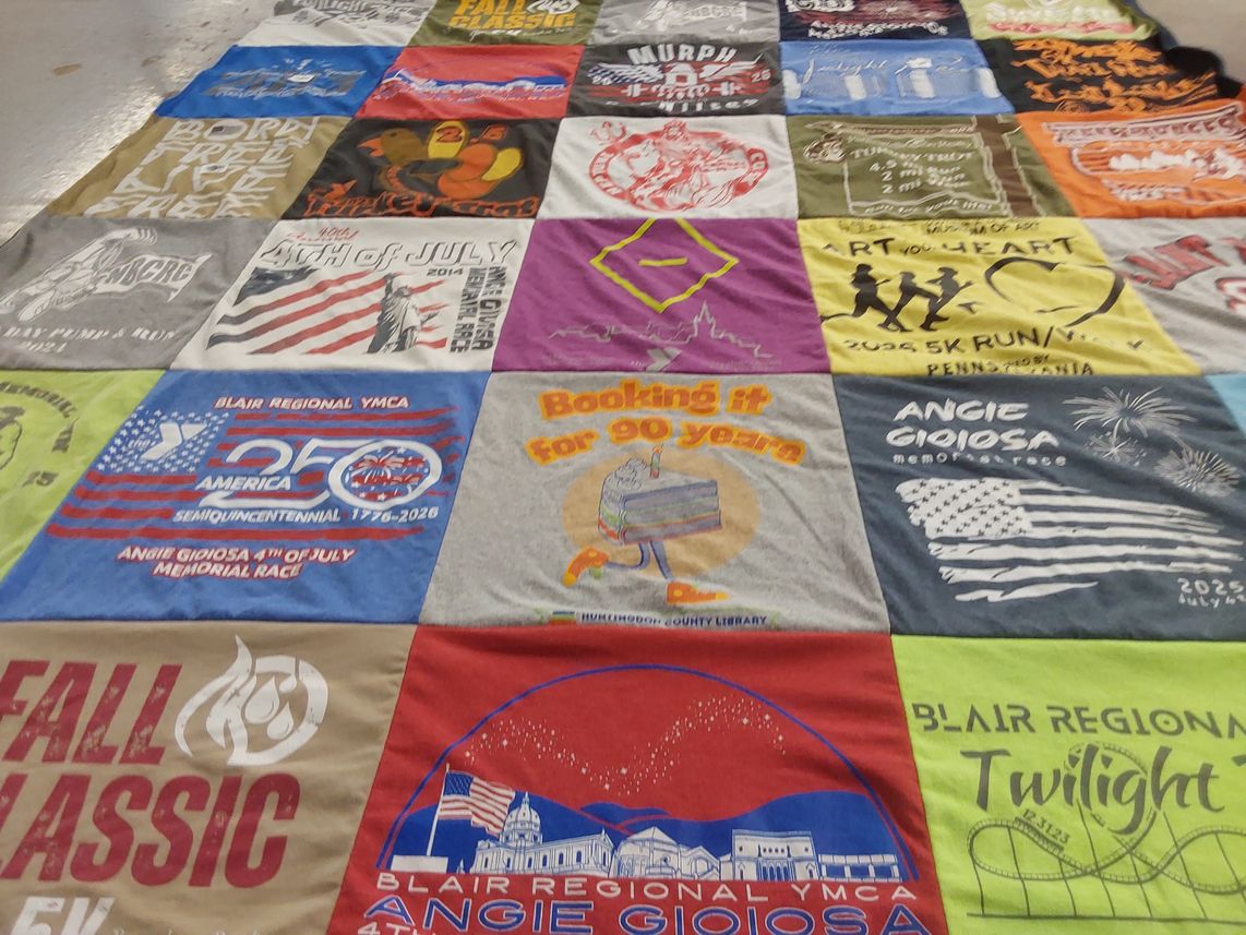 T-shirt quilt with running, community events themes by Marcella from PA