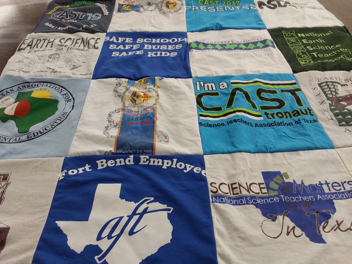 T-shirt quilt with education, science themes by Sevin from TX