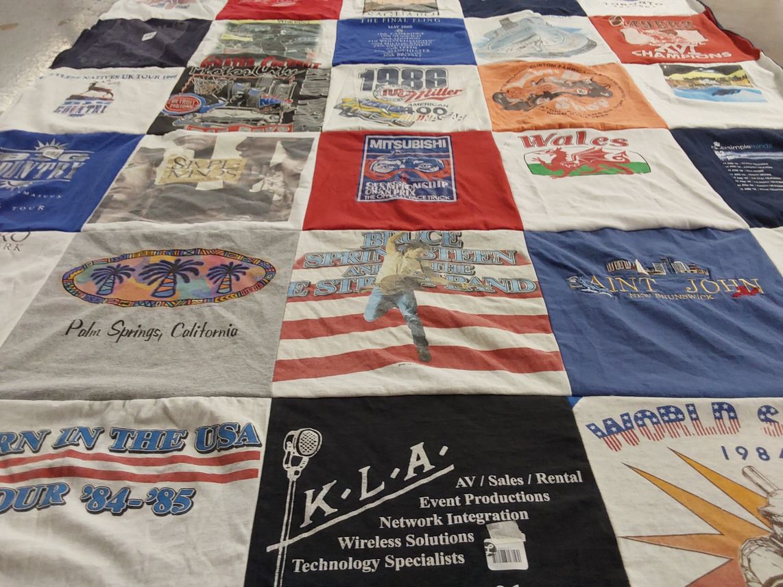 T-shirt quilt with music, travel themes by Mary Lou from MI