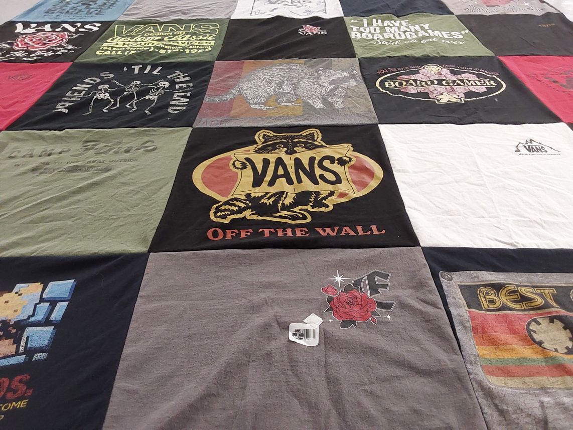 T-shirt quilt with skateboarding, board games themes by Sondra from TX