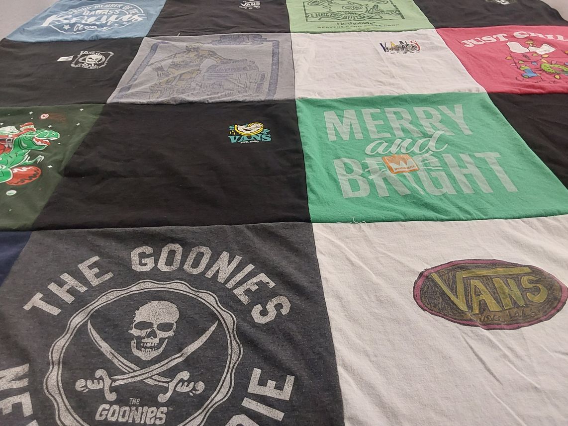 T-shirt quilt with movies, skateboarding themes by Sondra from TX