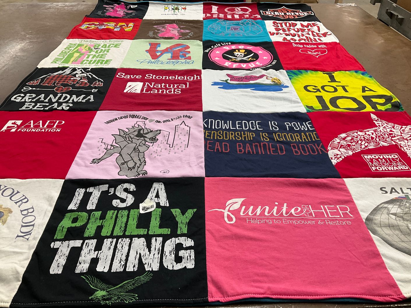 T-shirt quilt with community service, literacy themes by Susan from PA