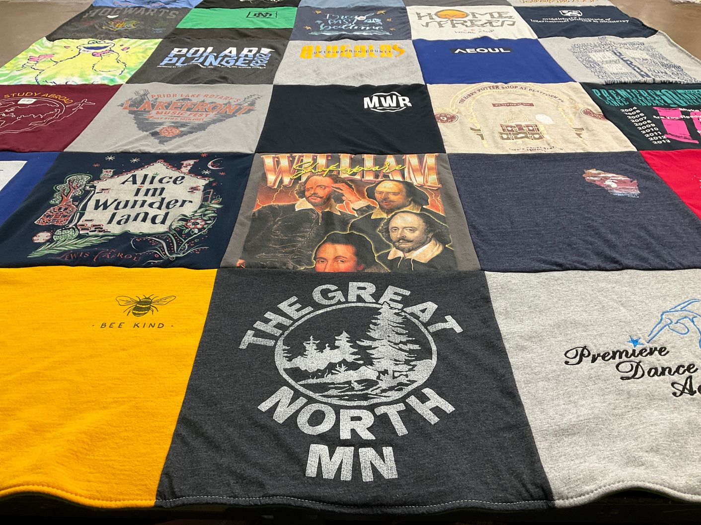 T-shirt quilt with literature, theater themes by Ali from MN