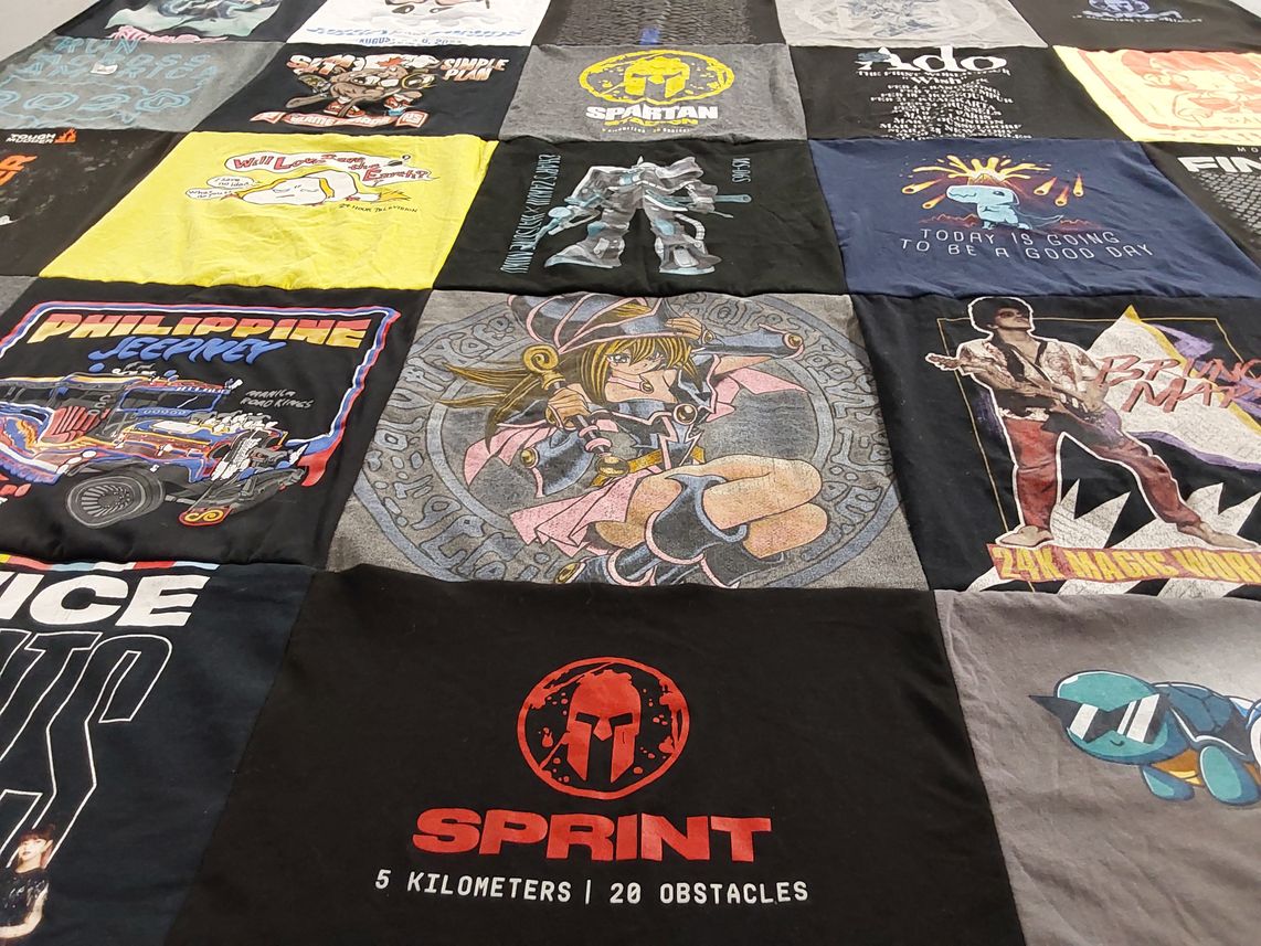T-shirt quilt with art, music themes by Michelle from NJ