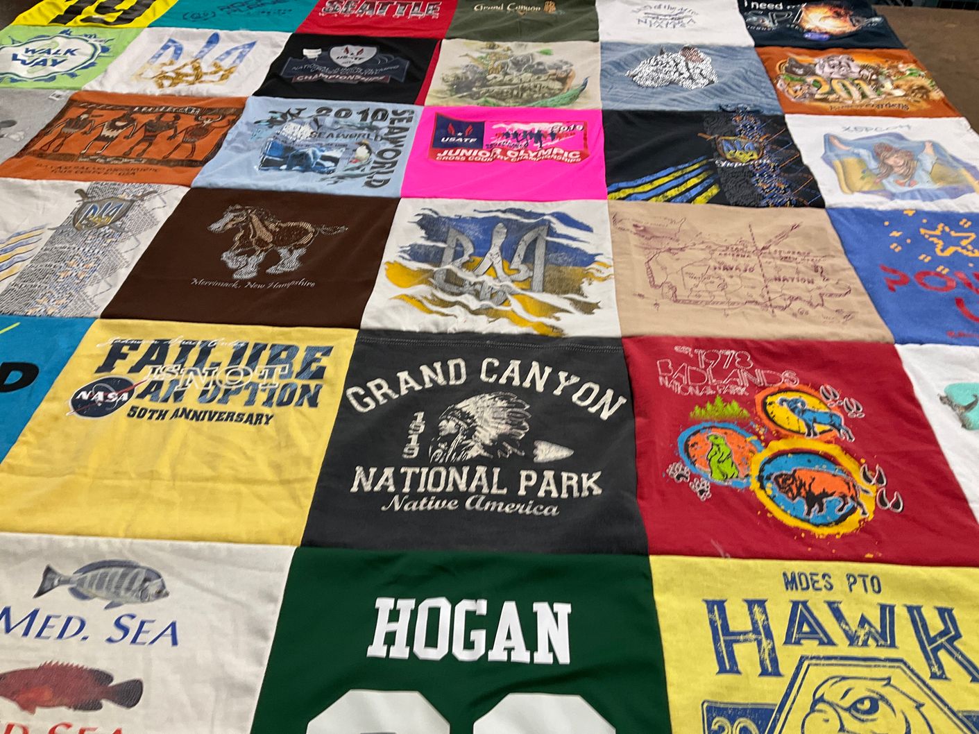 T-shirt quilt with national parks, space exploration themes by Olga from NH