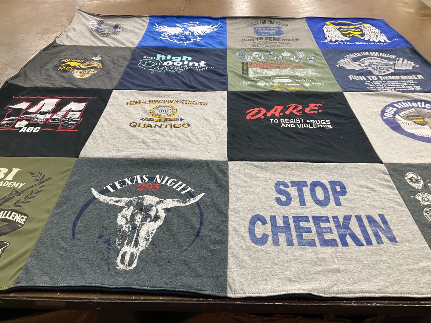 T-shirt quilt with law enforcement, community safety themes by Ashley from NC