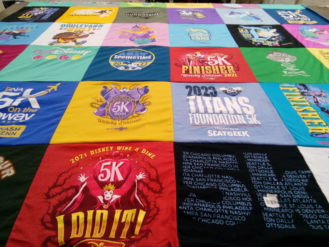 T-shirt quilt with running, events themes by Laura from TN
