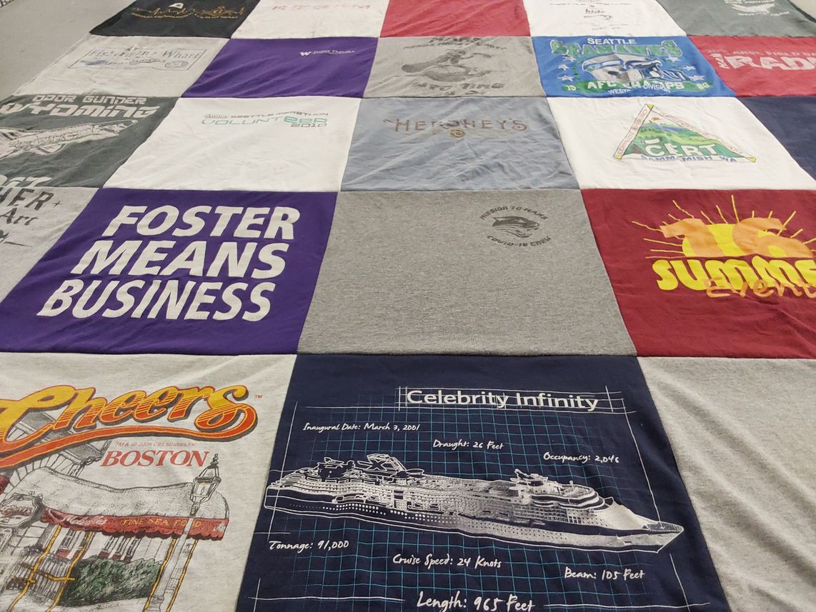 T-shirt quilt with travel, food themes by Jennifer from IN