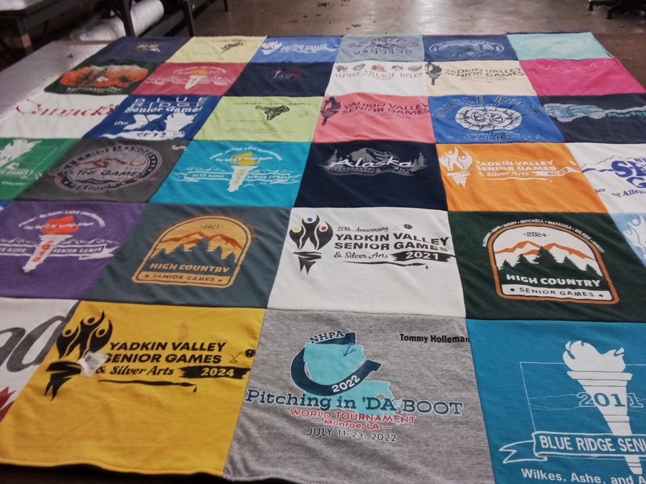 T-shirt quilt with sports, community events themes by Lena from NC