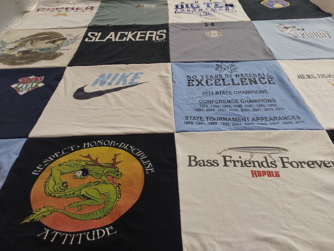 T-shirt quilt with fishing, sports themes by Carol from WI