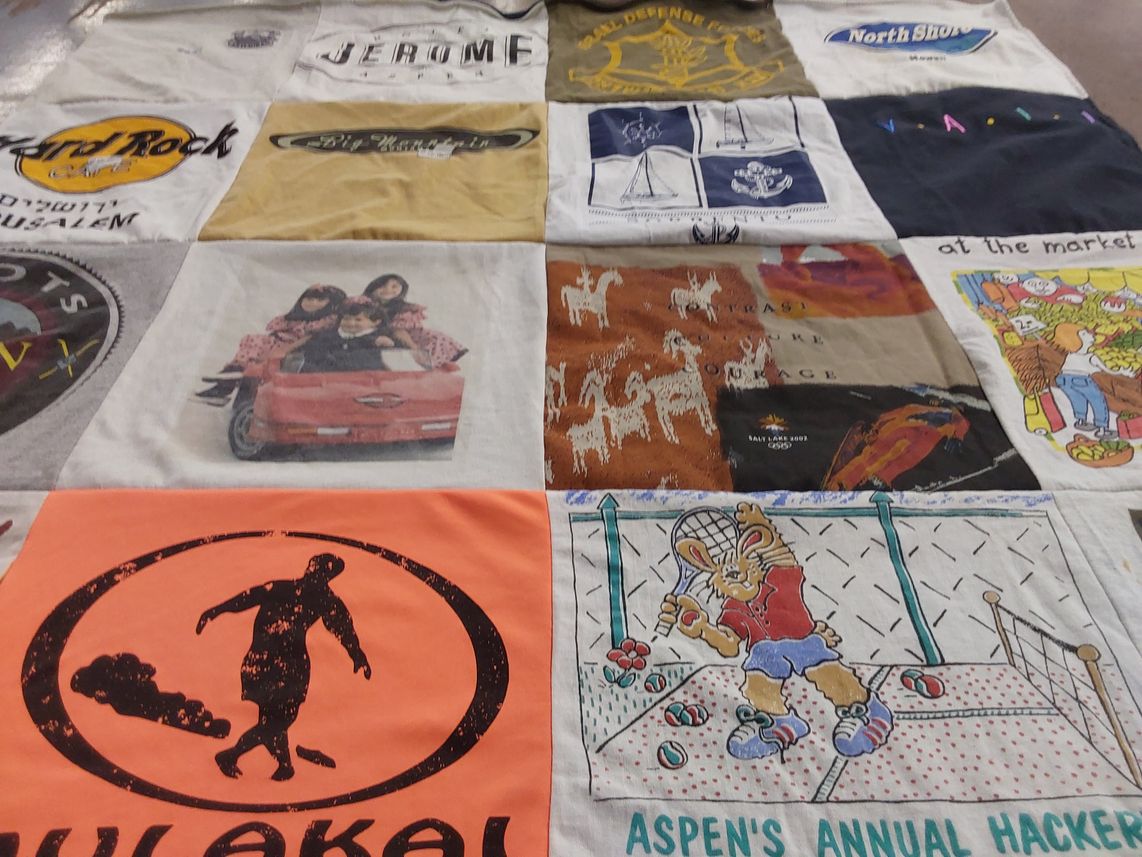 T-shirt quilt with arts, sports themes by Helene from NY