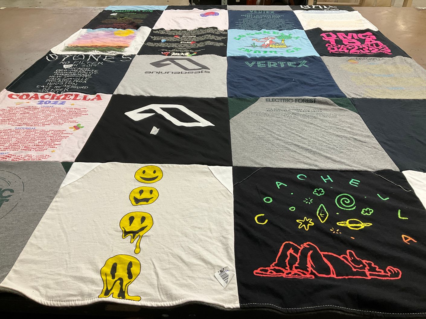 T-shirt quilt with music festivals, electronic music themes by Kaitlyn from CO