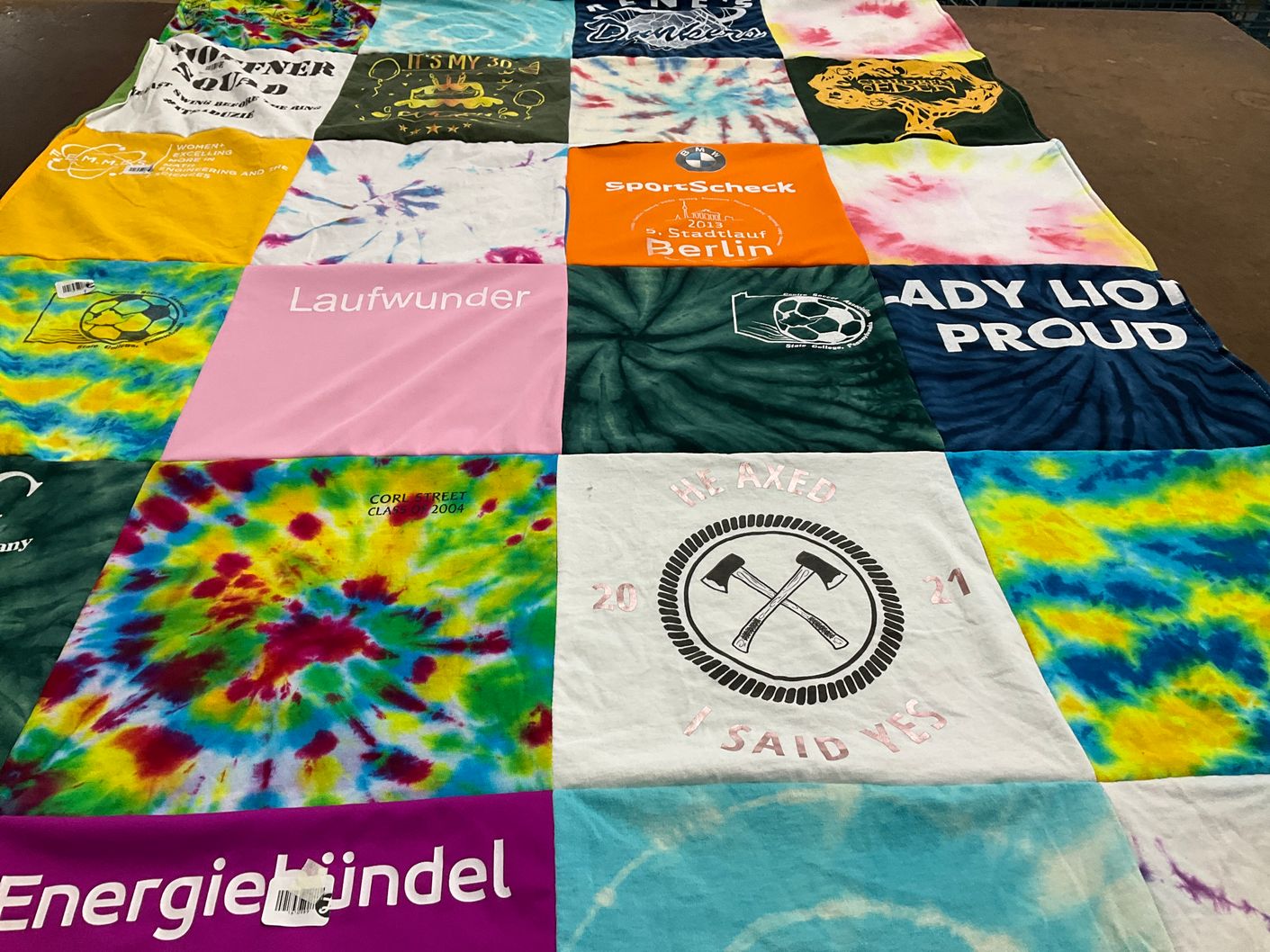 T-shirt quilt with tie dye, soccer themes by Pat from PA