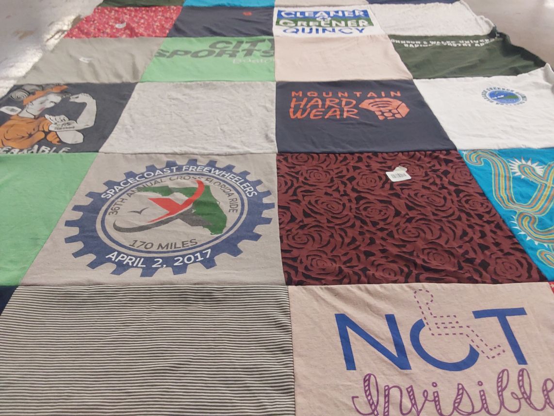 T-shirt quilt with cycling, environmentalism themes by Christy from MA