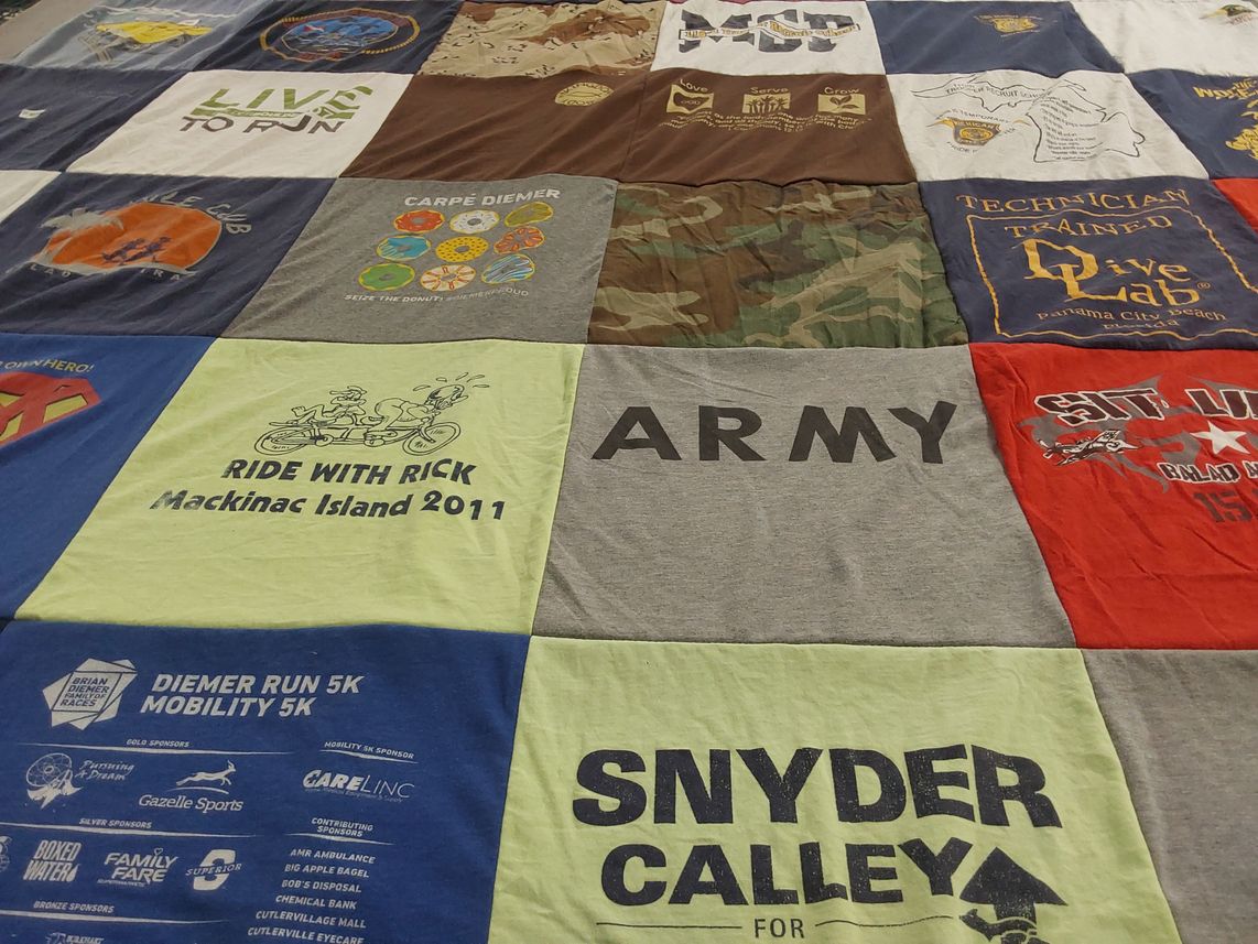 T-shirt quilt with running, cycling themes by Dale from MI