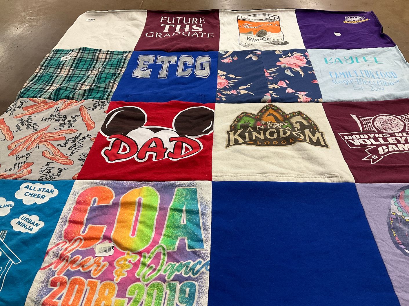 T-shirt quilt with cheerleading, graduation themes by Sandra from TN