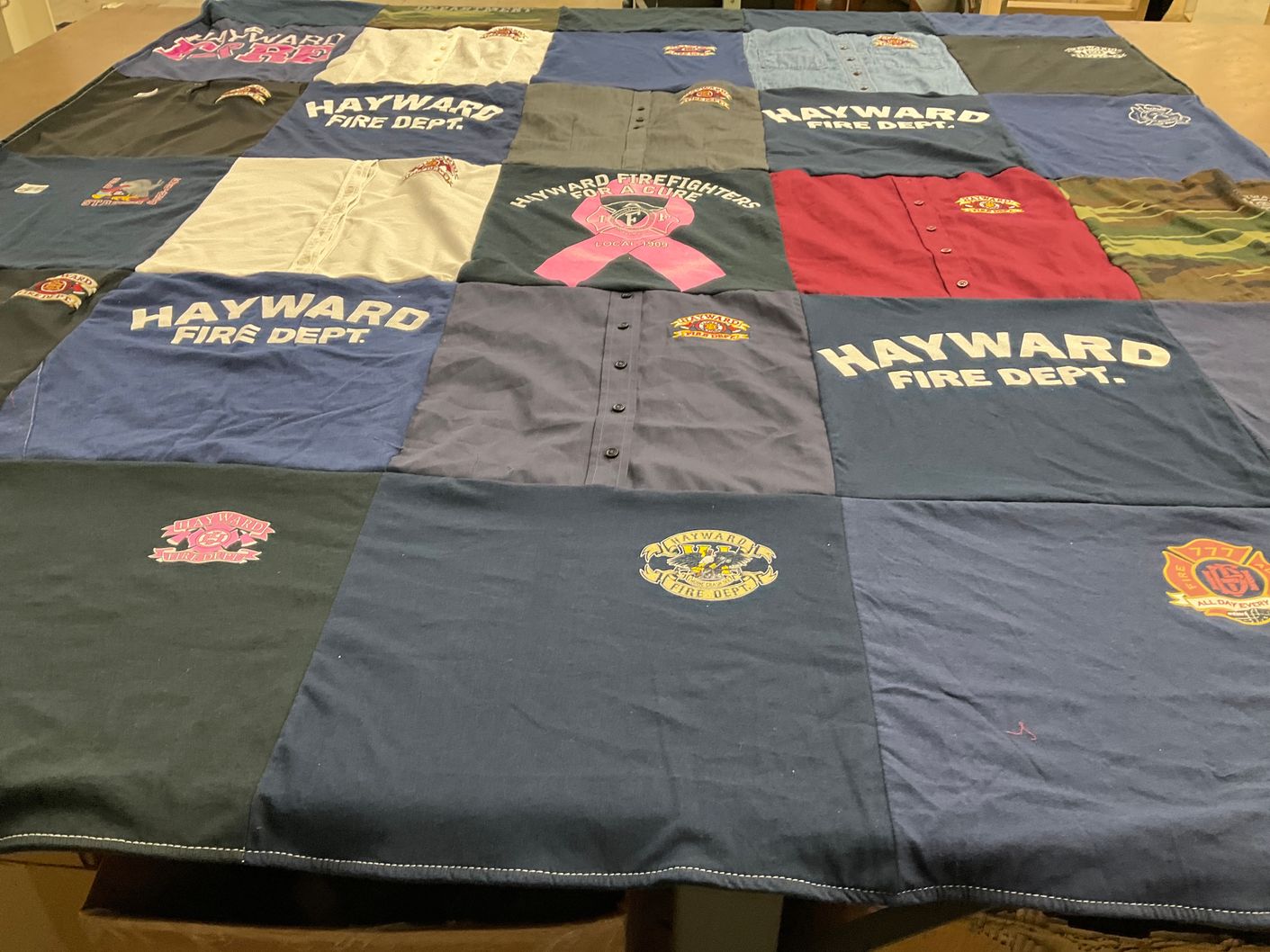 T-shirt quilt with fire fighting, emergency services themes by Tara from CA